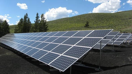 Land development company installs solar panel array for home owners on cleared land
